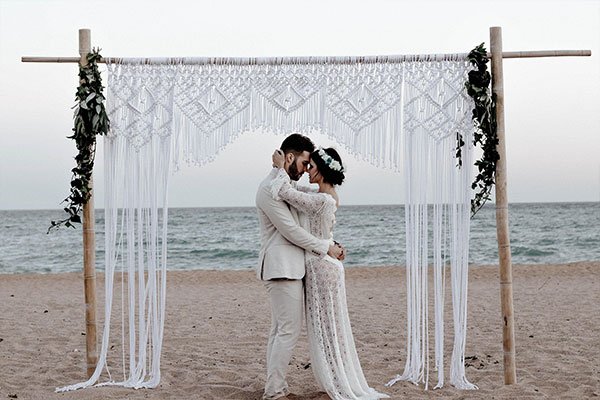 married couple on the beach at anavana beach resort